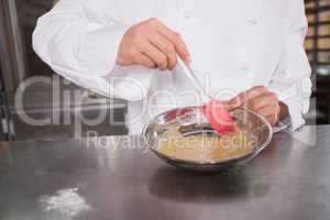 Close up of baker preparing a pastry