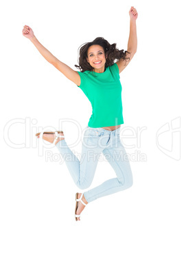 Pretty brunette jumping and smiling