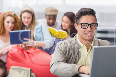 Fashion student using his laptop