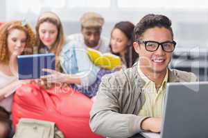 Fashion student using his laptop