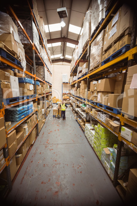 Worker with trolley of boxes