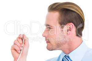 Focused businessman holding a cable