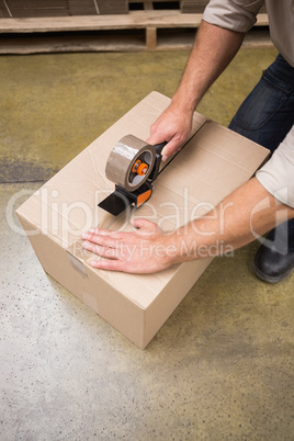 Close up of warehouse worker preparing a shipment