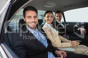 Business team working in the back seat