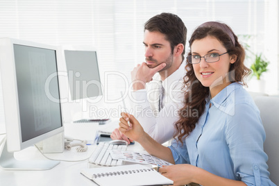 Business coworkers brainstorming together at desk