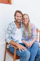 Attractive couple sitting on bench