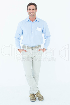 Confident businessman with hands in pockets