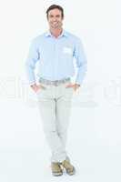 Confident businessman with hands in pockets