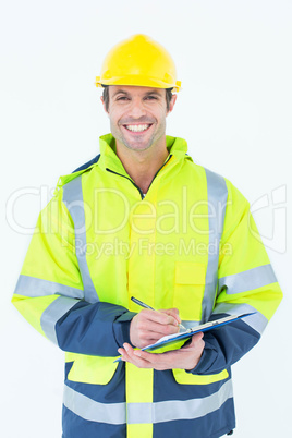 Architect writing notes on clipboard Architect writing notes on clipboard