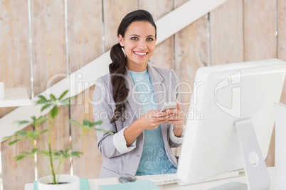 Stylish brunette working from home