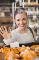 Pretty brunette looking at pastrys