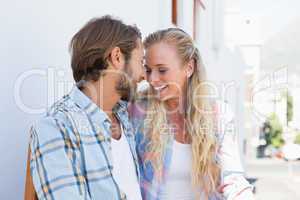 Attractive couple sitting on bench