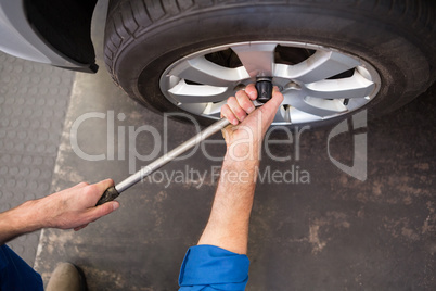 Mechanic adjusting the tire wheel