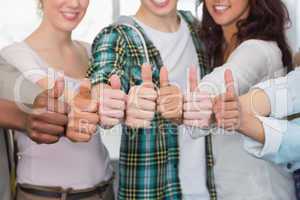 Fashion students showing thumbs up