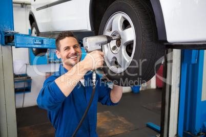 Mechanic adjusting the tire wheel