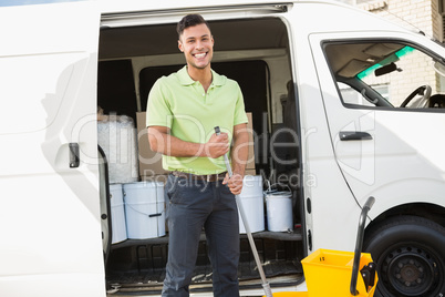 Cleaning agent standing smiling at camera