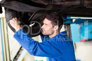 Mechanic adjusting the tire wheel