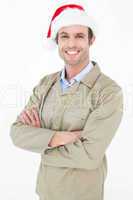 Delivery man in Santa hat standing arms crossed