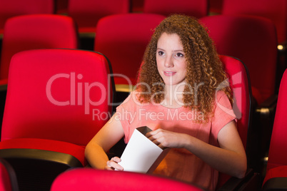 Young woman watching a film