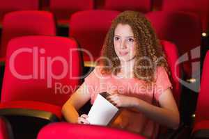 Young woman watching a film