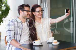 Cute couple on a date taking a selfie