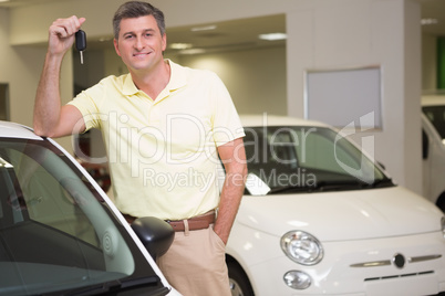 Customer standing while holding car key