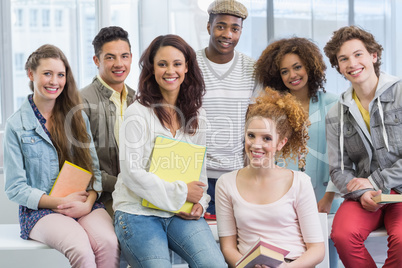 Fashion students smiling at camera together