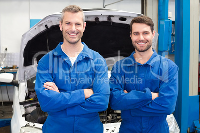 Team of mechanics smiling at camera