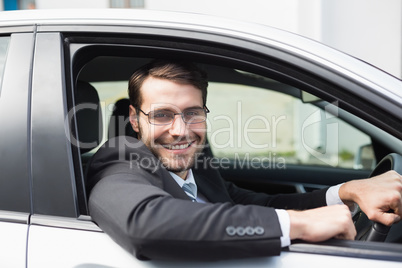 Happy businessman in the drivers seat