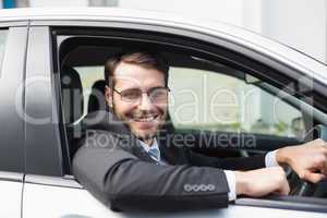 Happy businessman in the drivers seat