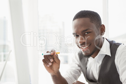 Portrait of a businessman holding cigarette