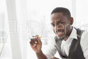 Portrait of a businessman holding cigarette