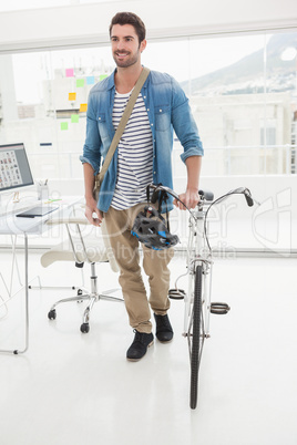 Casual businessman with his bicycle