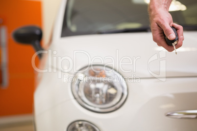 Close up of customer showing his new key