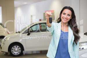 Smiling customer showing her new key