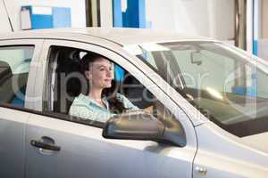 Smiling woman in her car