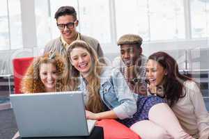 Fashion students smiling at camera together