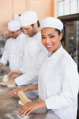 Team of bakers working at counter