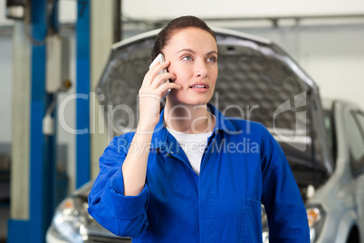 Mechanic talking on the phone
