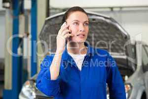 Mechanic talking on the phone