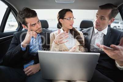 Business team working in the back seat