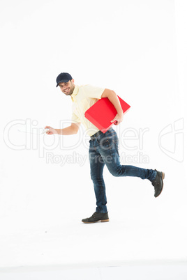 Delivery man with red box running on white background