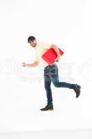Delivery man with red box running on white background