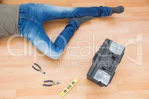 Man legs with toolbox on floor at home