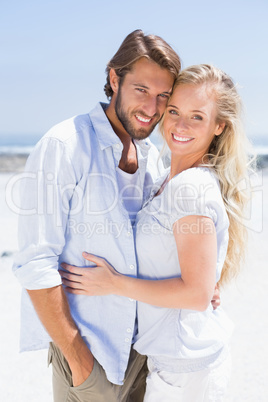 Cute couple hugging on the beach