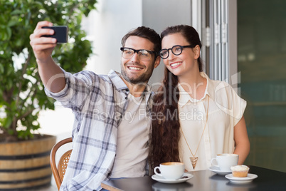 Cute couple on a date taking a selfie