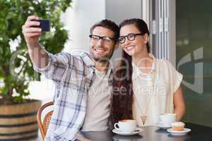 Cute couple on a date taking a selfie
