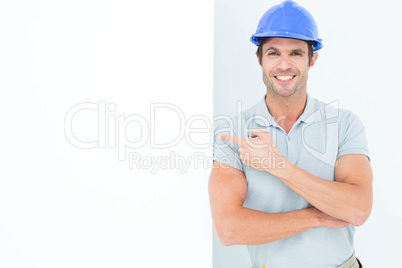 Smiling architect with bill board over white background