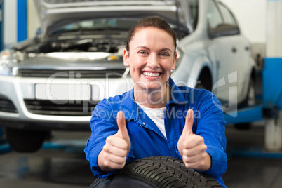 Mechanic smiling at the camera