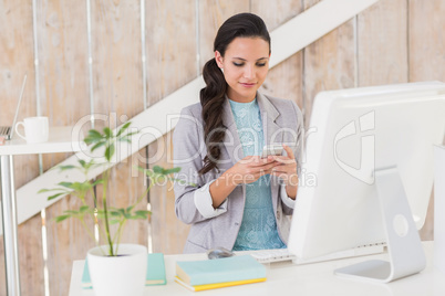 Stylish brunette working from home